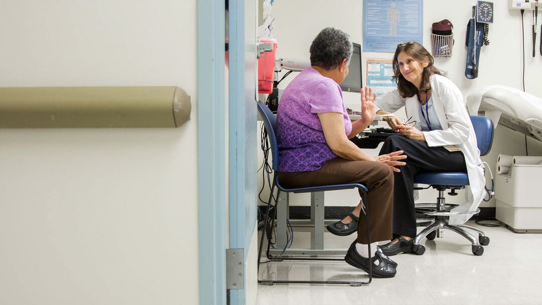 Alicia Fernandez, MD, Director of the Latinx Center Of Excellence, Associate Dean of Population Health and Health Equity, and professor of Clinical Medicine and attending physician in the General Medical Clinic and the Medical Wards at San Francisco General Hospital, meets with her long-time patient Ana Luianes.