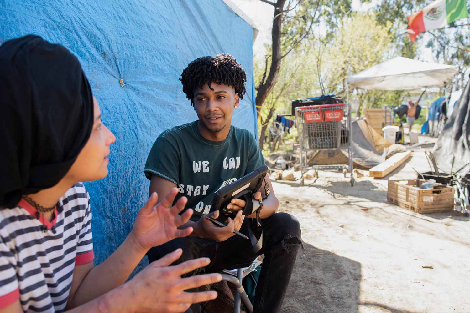 A woman speaks to a BHHI staff member about being unhoused.